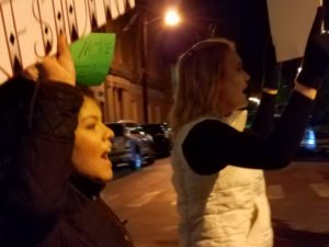 Transy juniors Paola Garcia and Kacy Hines march with demonstrators down Short St.