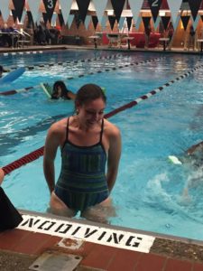 Junior Savannah Hemmer of Phi Mu catches her breath after finishing the float relay, a surprisingly difficult event for everyone involved.