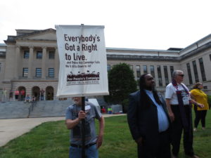 Sign reads "Everybody's Got a Right to Live"