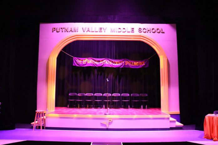 IMG_2802 The Putnam County stage is set, purple and yellow lights and decor.